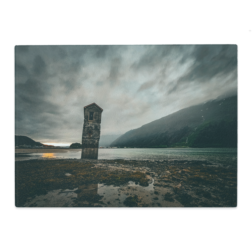 Sam Gilliss Visual Arts tempered glass cutting board featuring a Stormy Sunset at Sandy Beach in Juneau, Alaska with vibrant ocean scene.