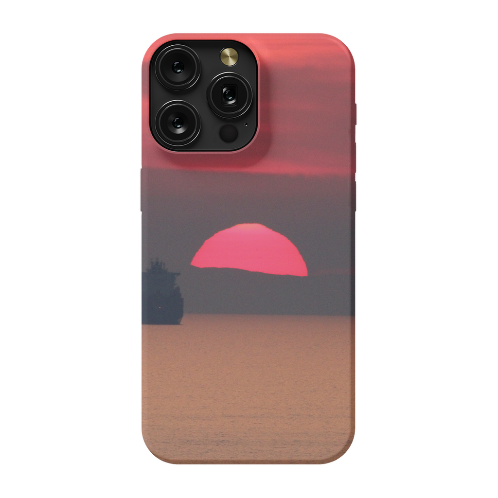 Premium cell phone case featuring Sam Gilliss Visual Arts' "Ship at Sunset, Corsica" artwork of a Mediterranean coast scene.