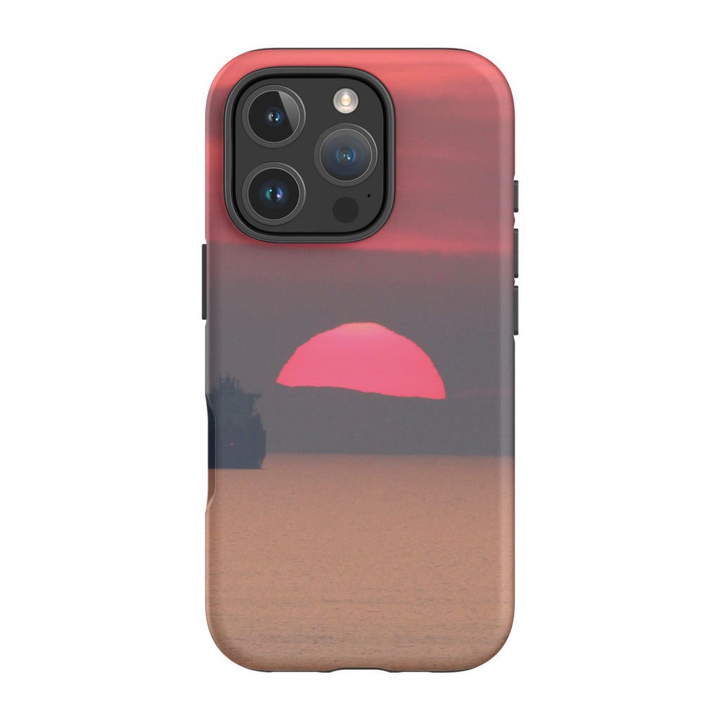 Premium cell phone case featuring Sam Gilliss Visual Arts' "Ship at Sunset, Corsica" artwork with Mediterranean coast scene.