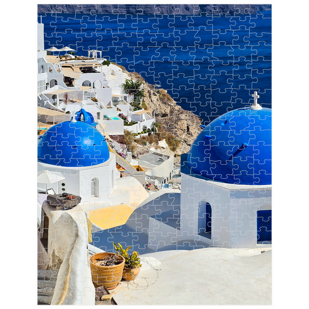 Sam Gilliss Visual Arts Santorini Blue Domes puzzle featuring Oia Greece, 1000-piece fine art jigsaw with vibrant seaside architecture.