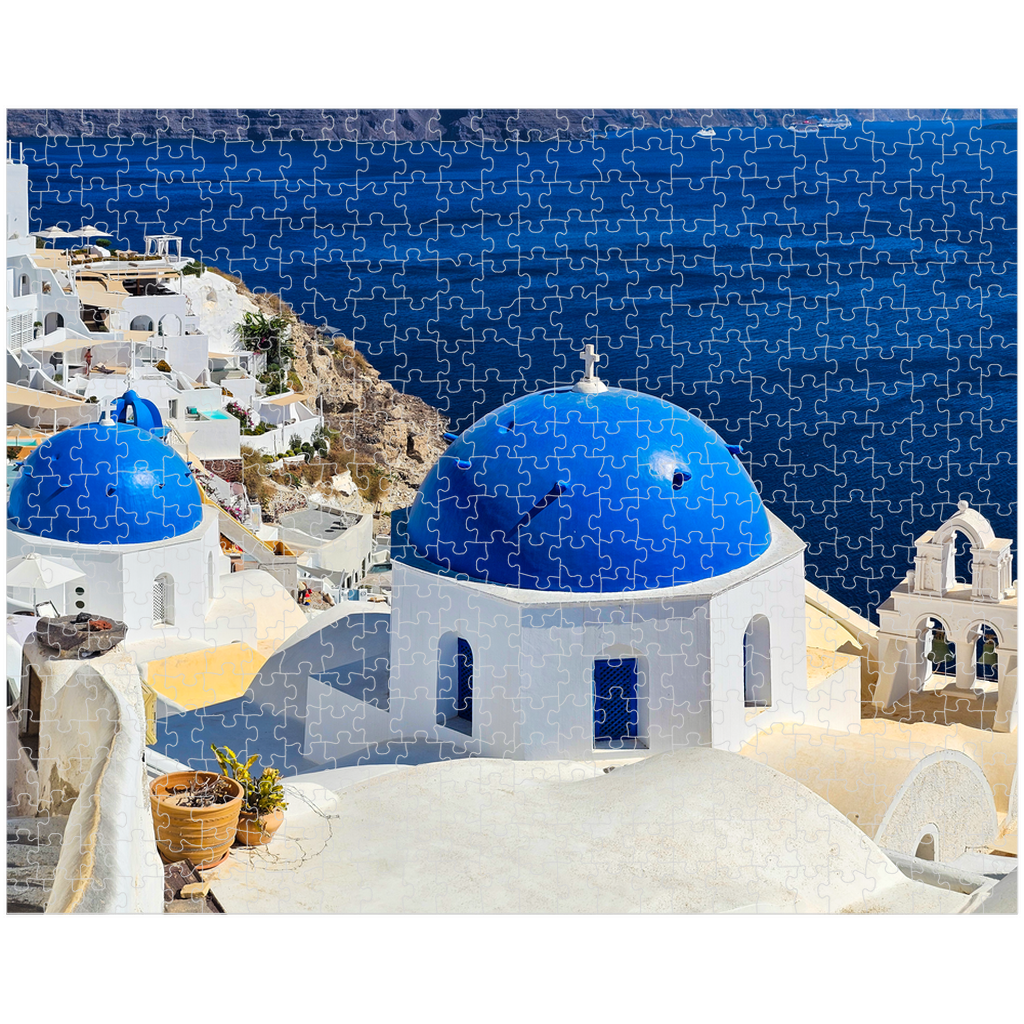 Sam Gilliss Visual Arts Santorini Blue Domes puzzle showing Oia Greece with vibrant blue domes, 1000-piece fine art jigsaw puzzle.