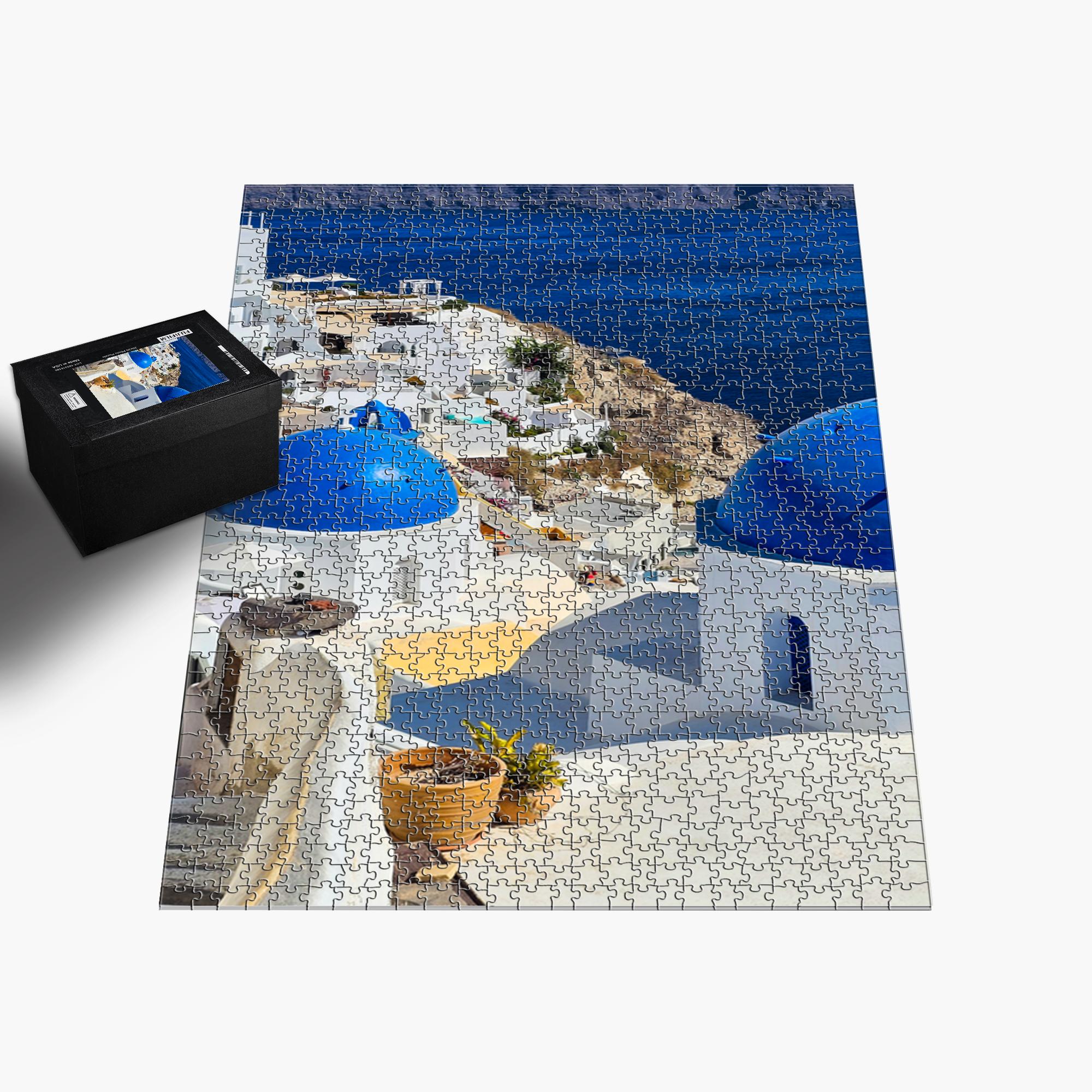 Sam Gilliss Visual Arts Santorini Blue Domes puzzle, 1000-piece jigsaw featuring iconic Oia Greece with vibrant blue domes and scenic views.