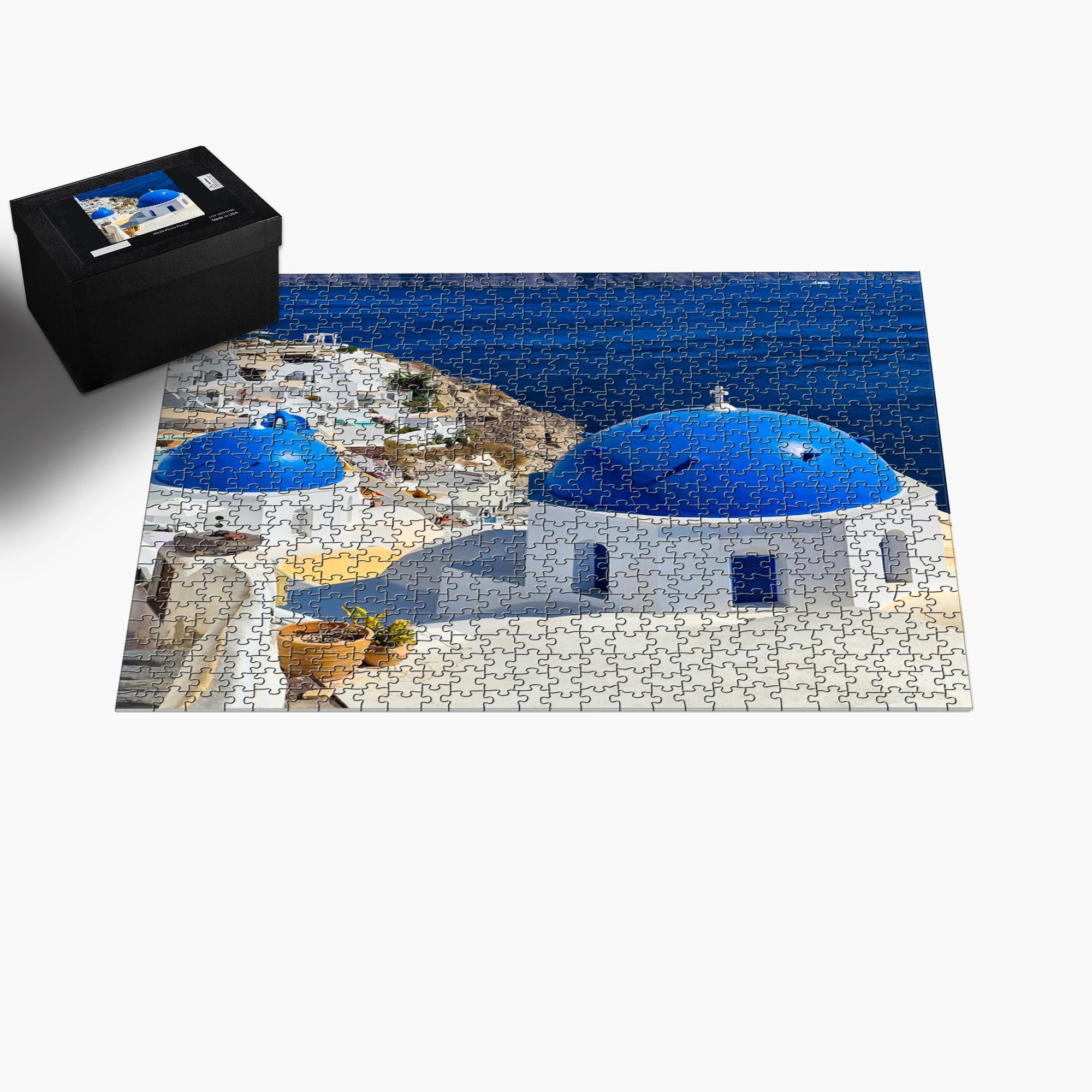 Sam Gilliss Visual Arts Santorini Blue Domes puzzle showing vibrant image of iconic Oia Greece with colorful blue-domed buildings and scenic seascape.