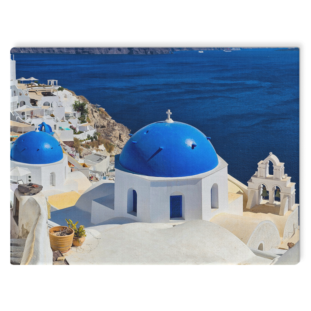 Santorini Blue Domes canvas wall art by Sam Gilliss Visual Arts featuring iconic Oia, Greece, with vibrant blue domes and Mediterranean scenery.