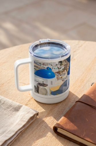 Sam Gilliss Visual Arts Santorini Blue Domes 10oz insulated stainless steel travel mug with handle, featuring colorful dome artwork.