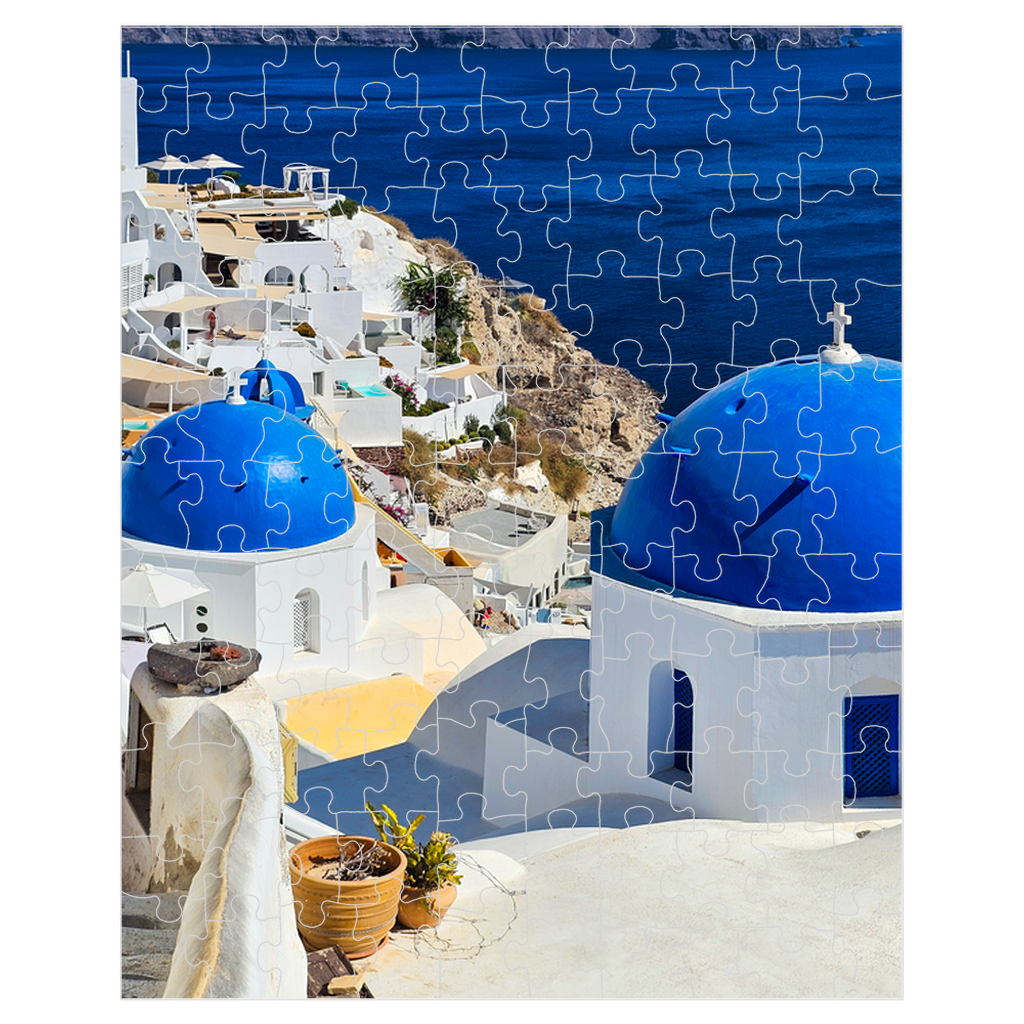 Sam Gilliss Visual Arts Santorini Blue Domes puzzle featuring vibrant image of Oia Greece with 110 to 1000 pieces.