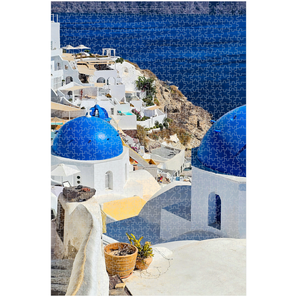 Sam Gilliss Visual Arts Santorini Blue Domes puzzle featuring Oia Greece scene with colorful blue-domed buildings, 110 to 1000 pieces.