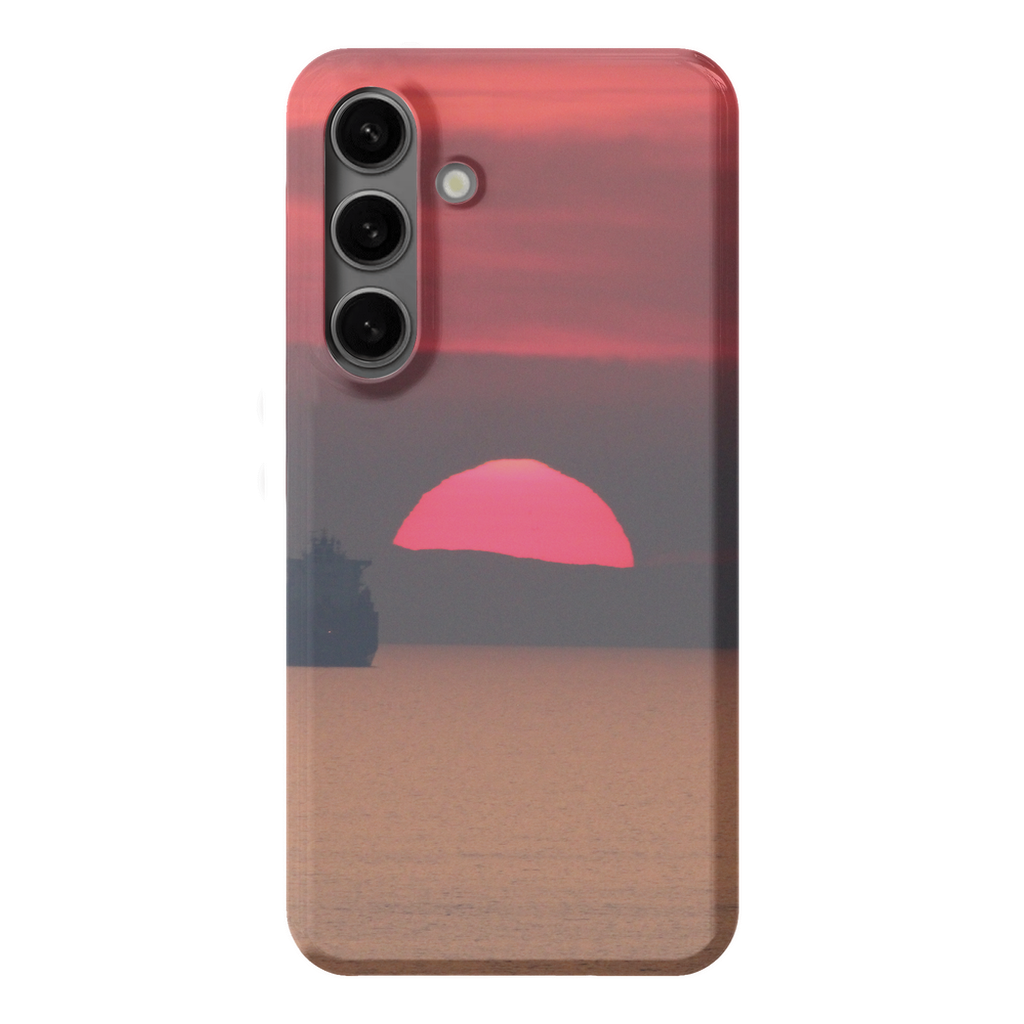 Premium cell phone case featuring Sam Gilliss Visual Arts' "Ship at Sunset, Corsica" artwork with Mediterranean coast scene.