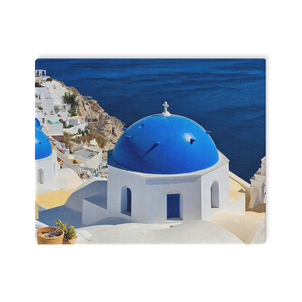 Santorini Blue Domes canvas wall art by Sam Gilliss, depicting Oia, Greece with iconic blue-domed buildings and Mediterranean coastal scenery.