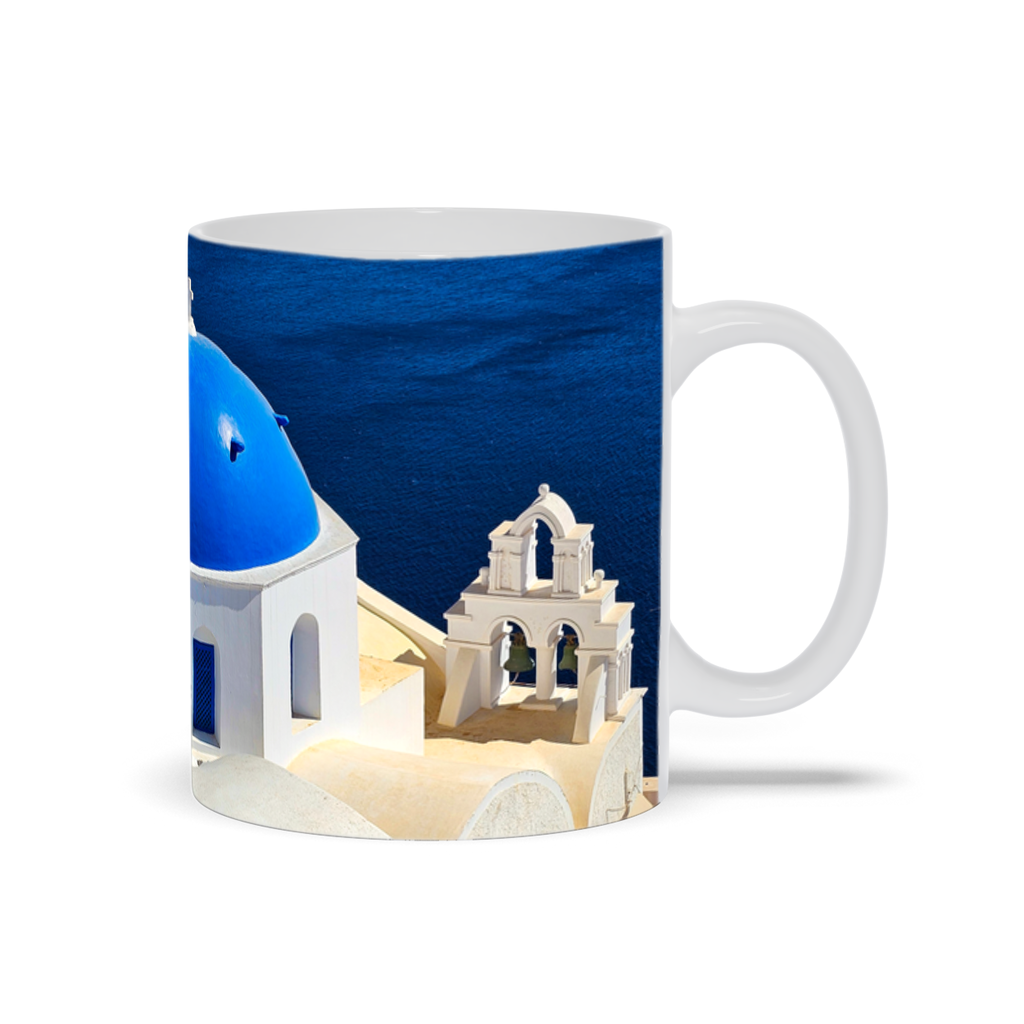 Ceramic coffee mug featuring the blue domes of Oia, Santorini, by Sam Gilliss Visual Arts, ideal for travel enthusiasts.
